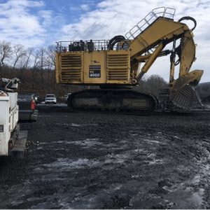A large hydraulic machine on an outdoor industrial jobsite