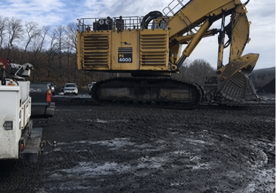 A large hydraulic machine on an outdoor industrial jobsite